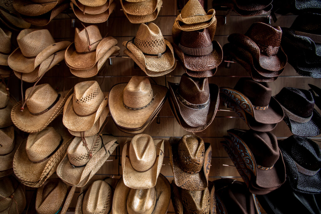 Rack of straw cowboy hats